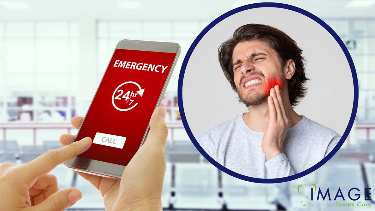 A man holding his mouth in pain.