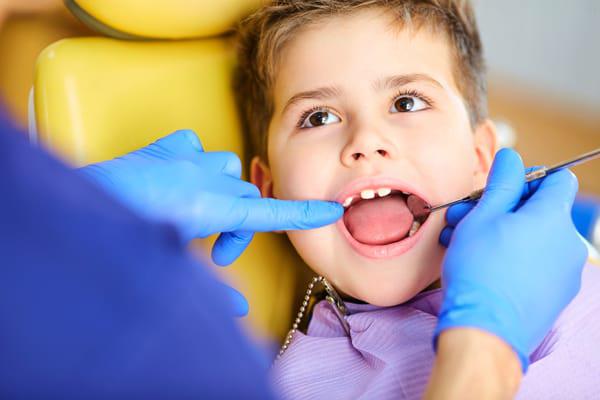 child visiting dentist advertising children's dentistry