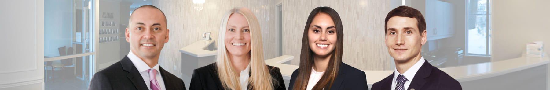 Dr. Helen deMan, Dr. Harry Höediono, Dr. Caley Höediono, and Dr. Mike Schenkel, dentists in Kitchener.