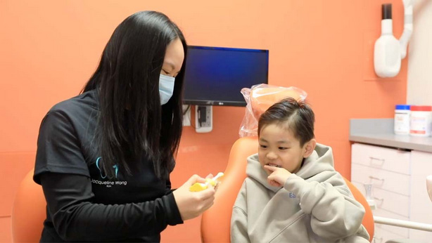 Markham Dental Treatment Coordinator discussing treatment with a patient.