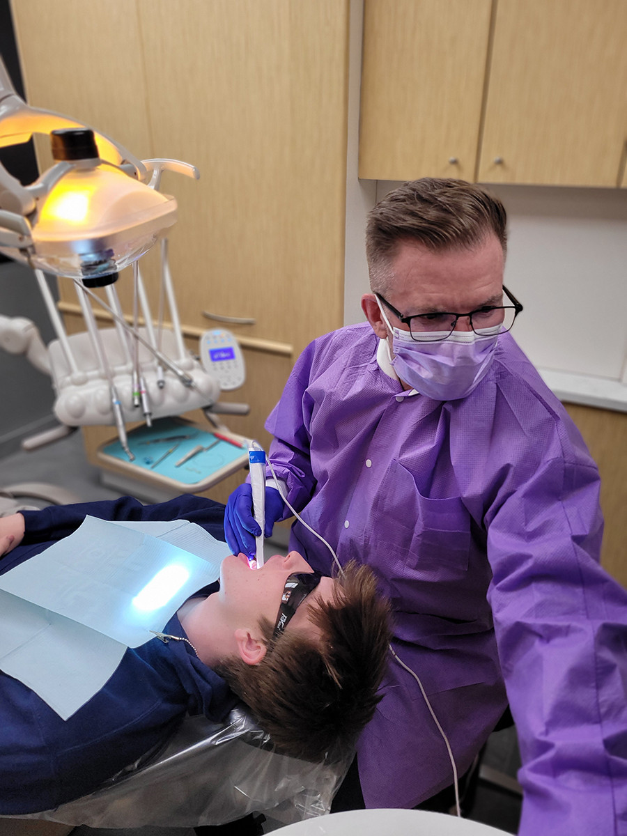 Dr Todd Donnelly with a patient.