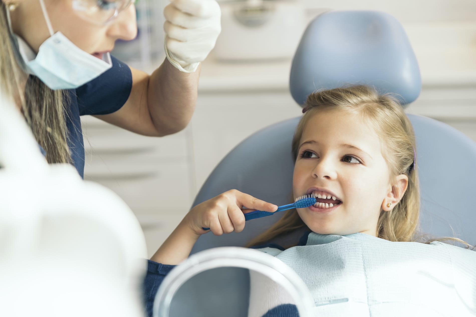 A little girl at her dental exam.