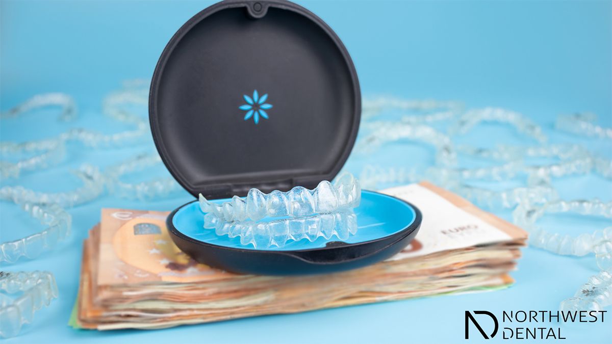 An Invisalign tray in a black case with baby blue trim.