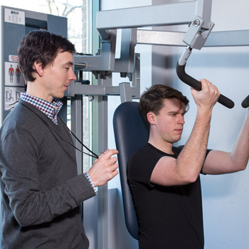 Personal Trainer working with a client.