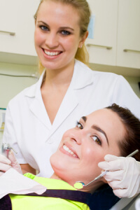 Dentist and patient smiling