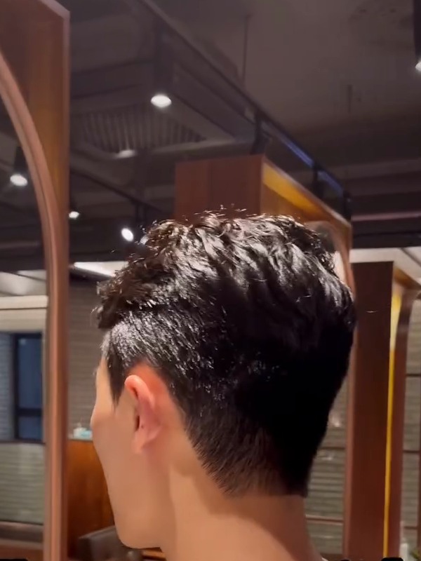 Textured Men's Perm

A soft, textured perm on top with a clean taper at the back and sides. Natural movement that is easy to style every morning.