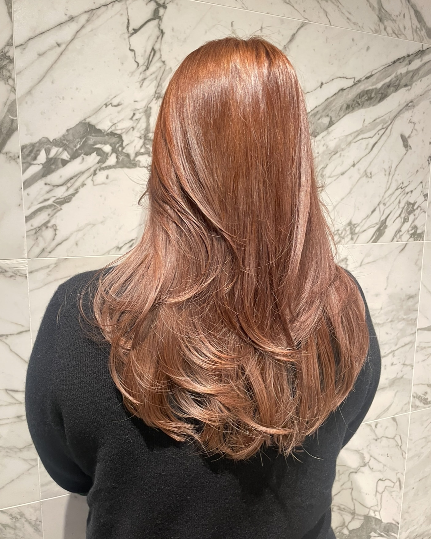 Copper Long Layers

A warm copper-brown with a high-gloss finish, cut in long layers that curve softly at the ends.