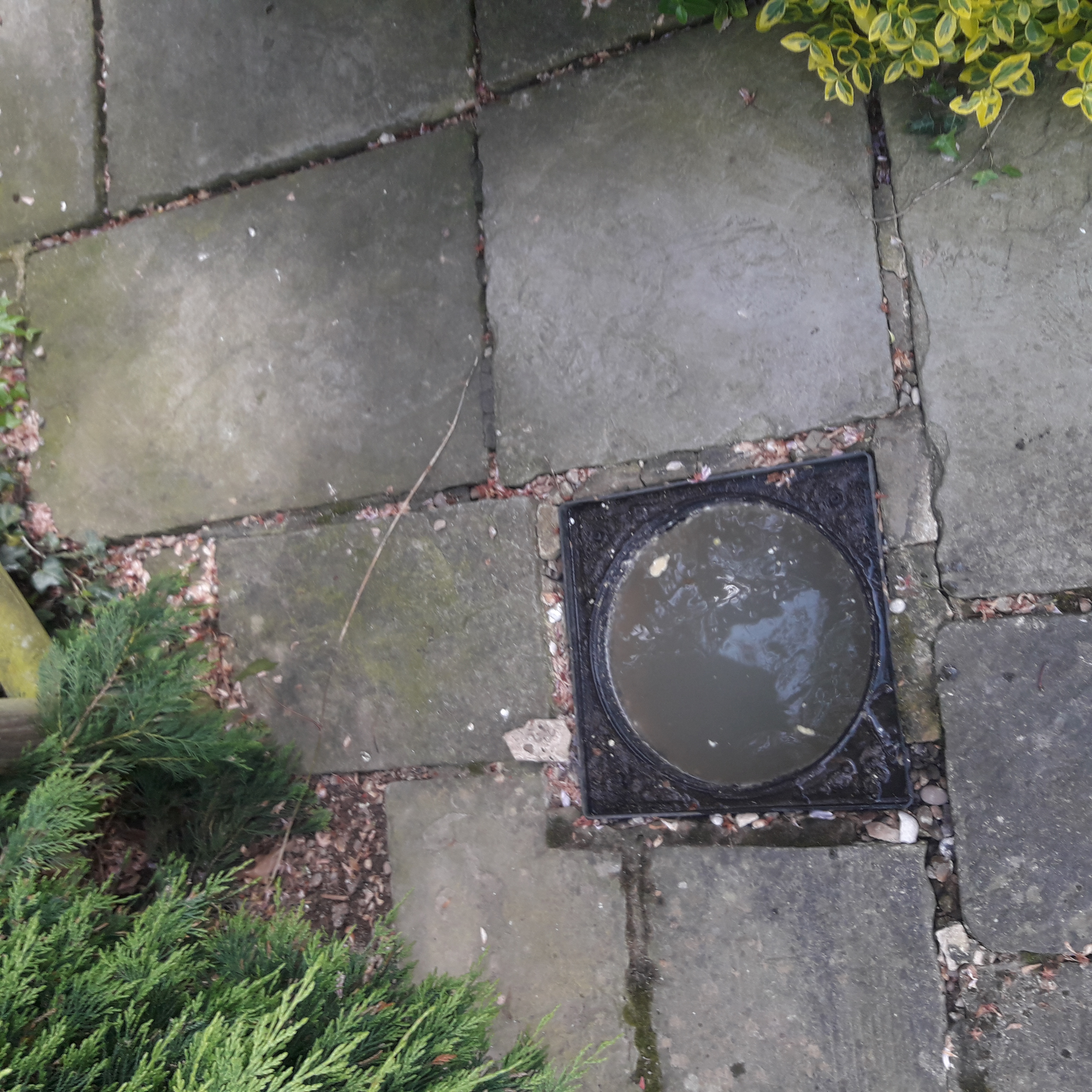 Manhole chamber before clearance showing wipes obstruction