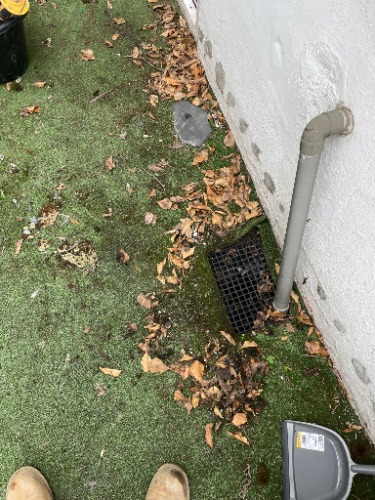Blocked rainwater gully identified during a drainage inspection at a property in Hendon (NW4).