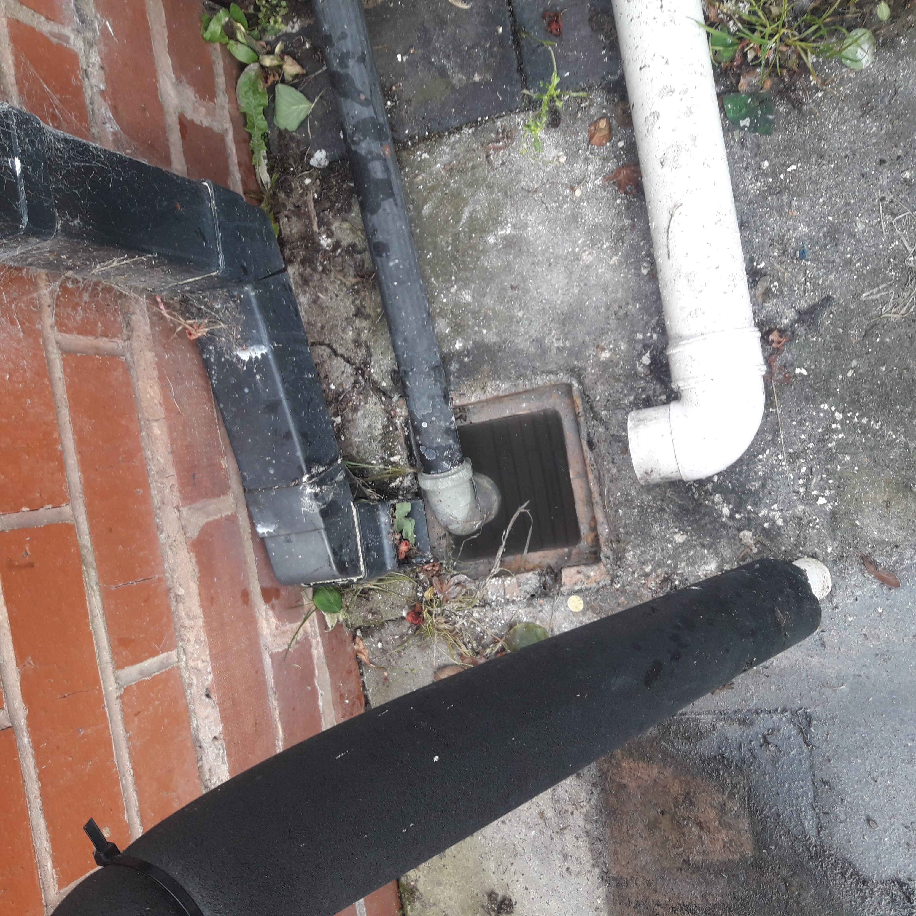 External sink gully blocked with food residues before clearance.