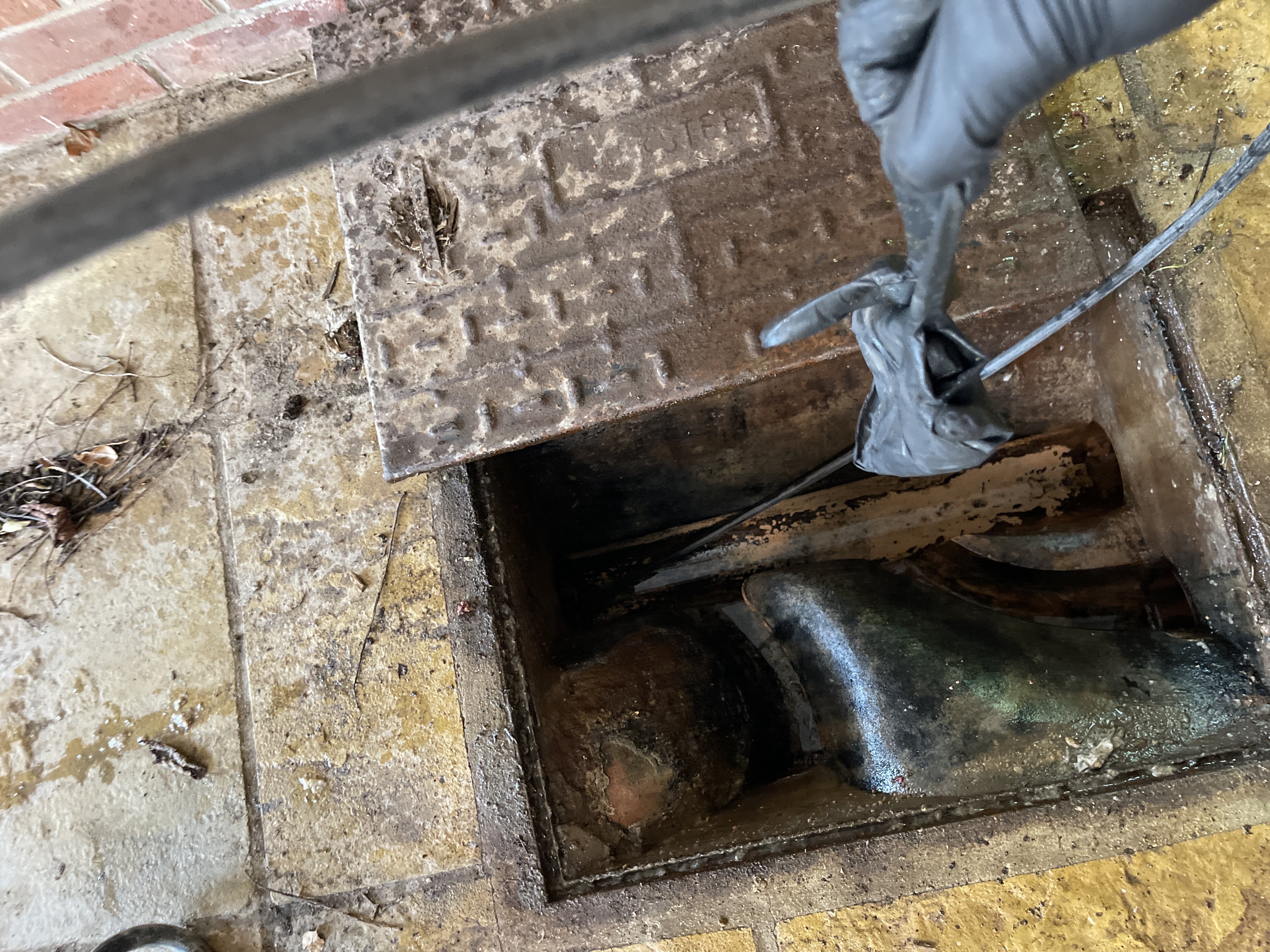 Blocked manhole cleared using high-pressure water jetting at a property in Long Hanborough (OX29).