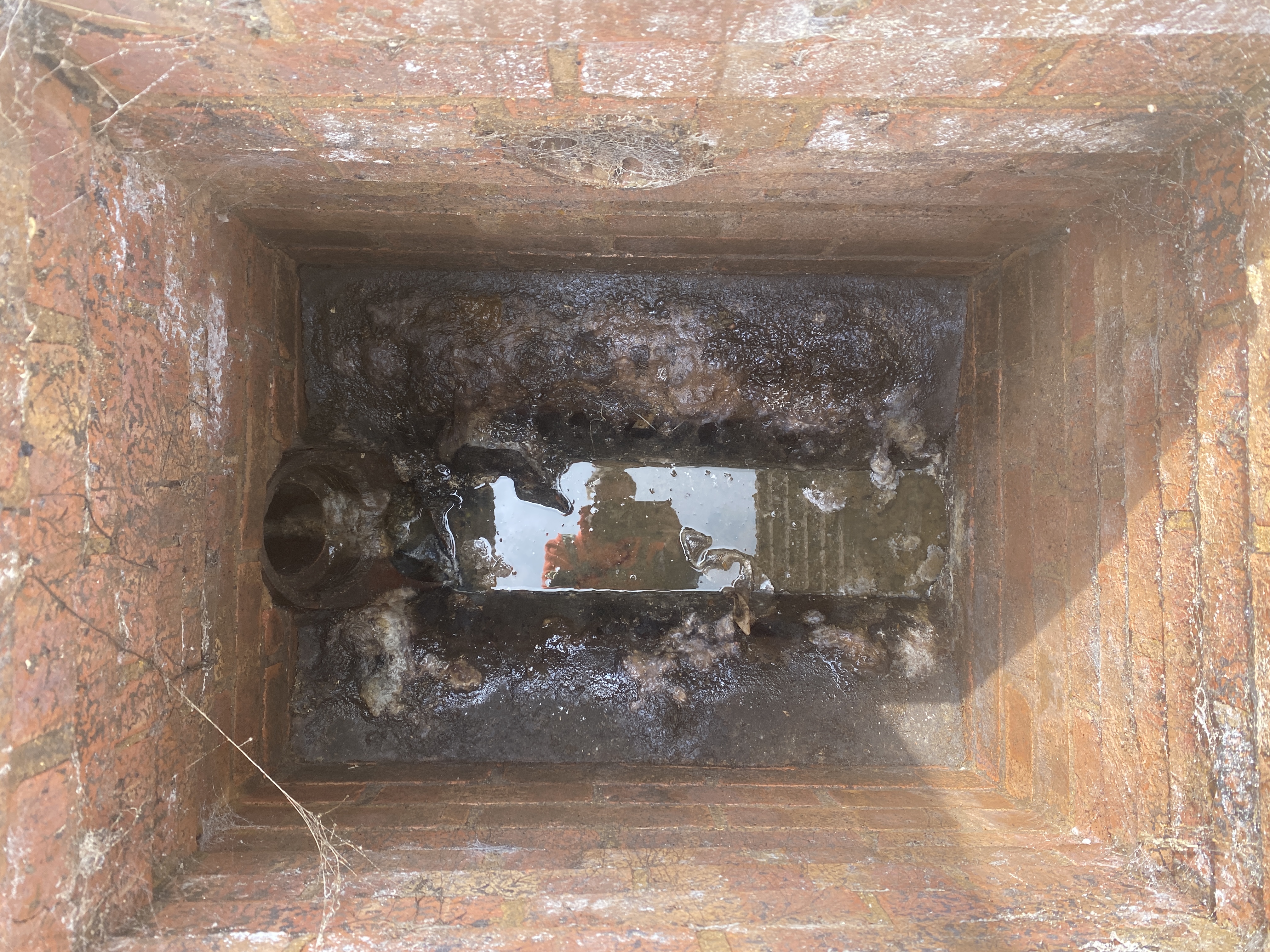 High-pressure water jetting setup used to clear a blocked drain at a property in London Colney, Hertfordshire.