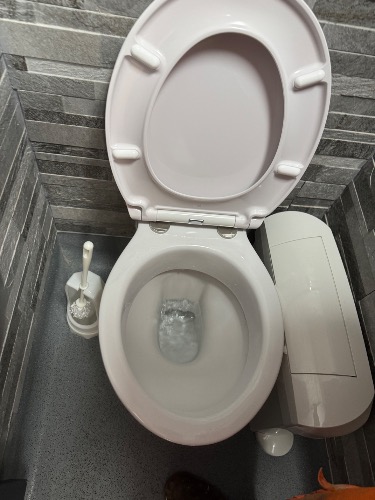 Compacted obstruction causing toilet backup in Newmarket CB8.