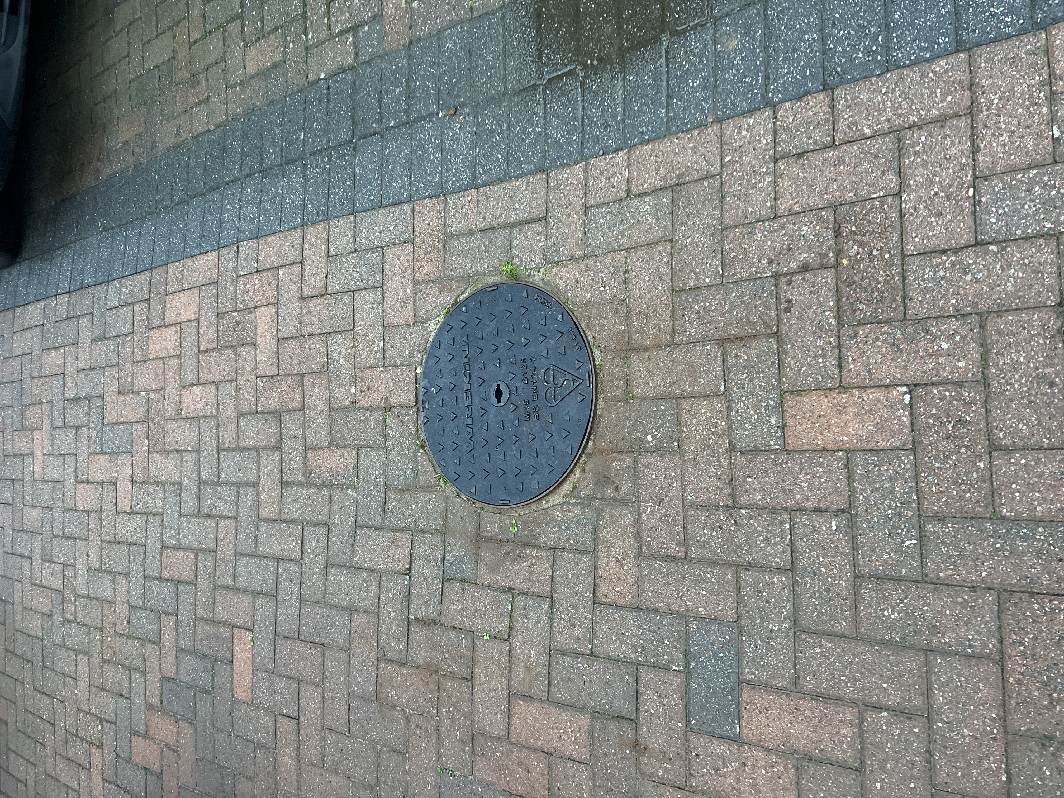 New manhole cover and frame securely installed at a property in NN4 Northampton.
