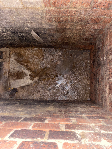 Concrete obstruction restricting flow inside drainage line in Bracknell RG12.
