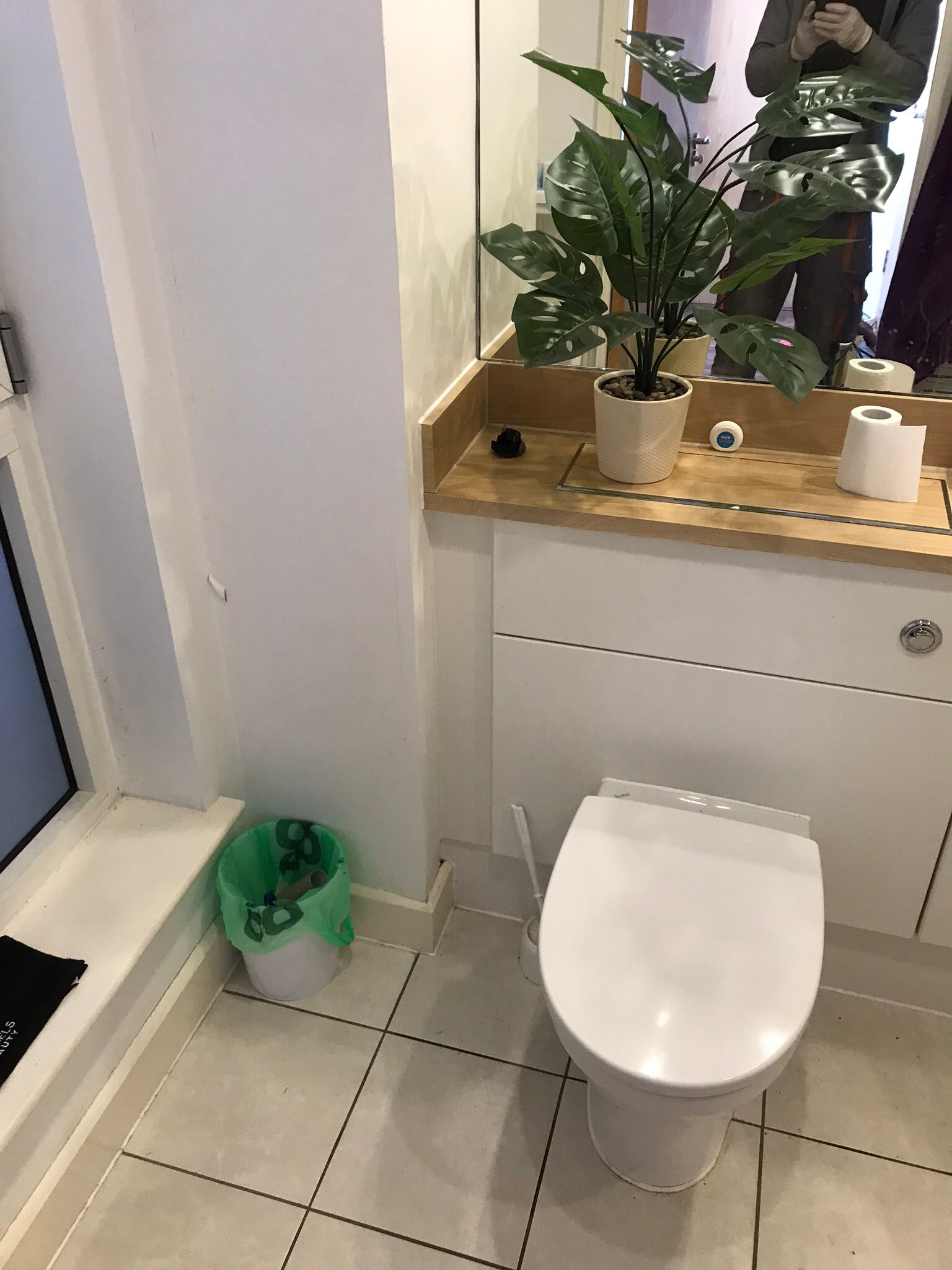 Rear of toilet access area inspected during the odour investigation at the Hackney property.