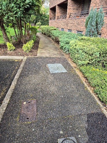 High-pressure water jetting used to service rainwater drains at a property in Teddington (TW11).