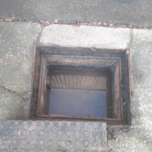 Blocked manhole accessed in Tamworth prior to clearance works.
