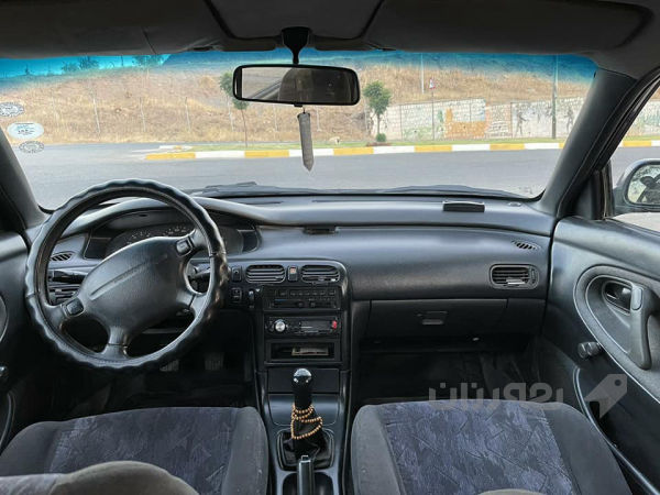 مازدا فاصۆلیای مۆدێل 1996، - 2