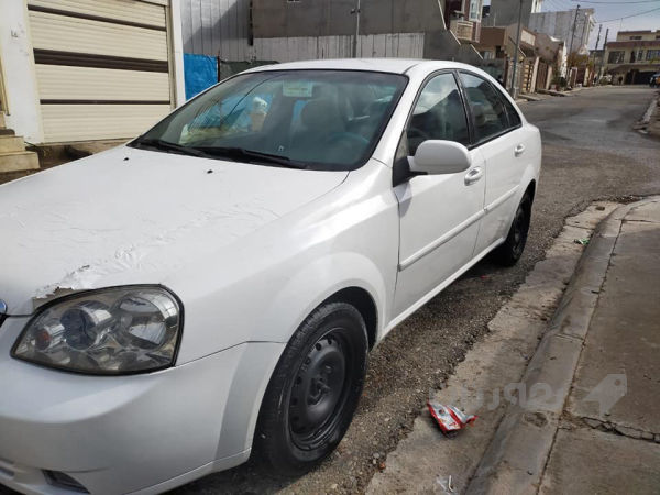 ئۆپترا مۆدیل ـ2010 رەنگی سپی ،،گیر عادی  - 2