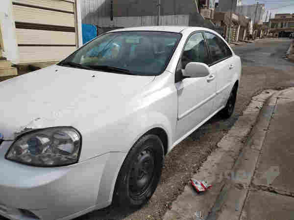 ئۆپترا مۆدیل ـ2010 رەنگی سپی ،،گیر عادی  - 2