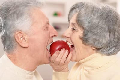 seniors eating an apple