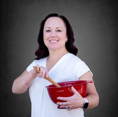 Dental Assistant, Crystal holding a mixing bowl and spoon.