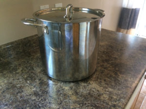 A covered pot on the stove.