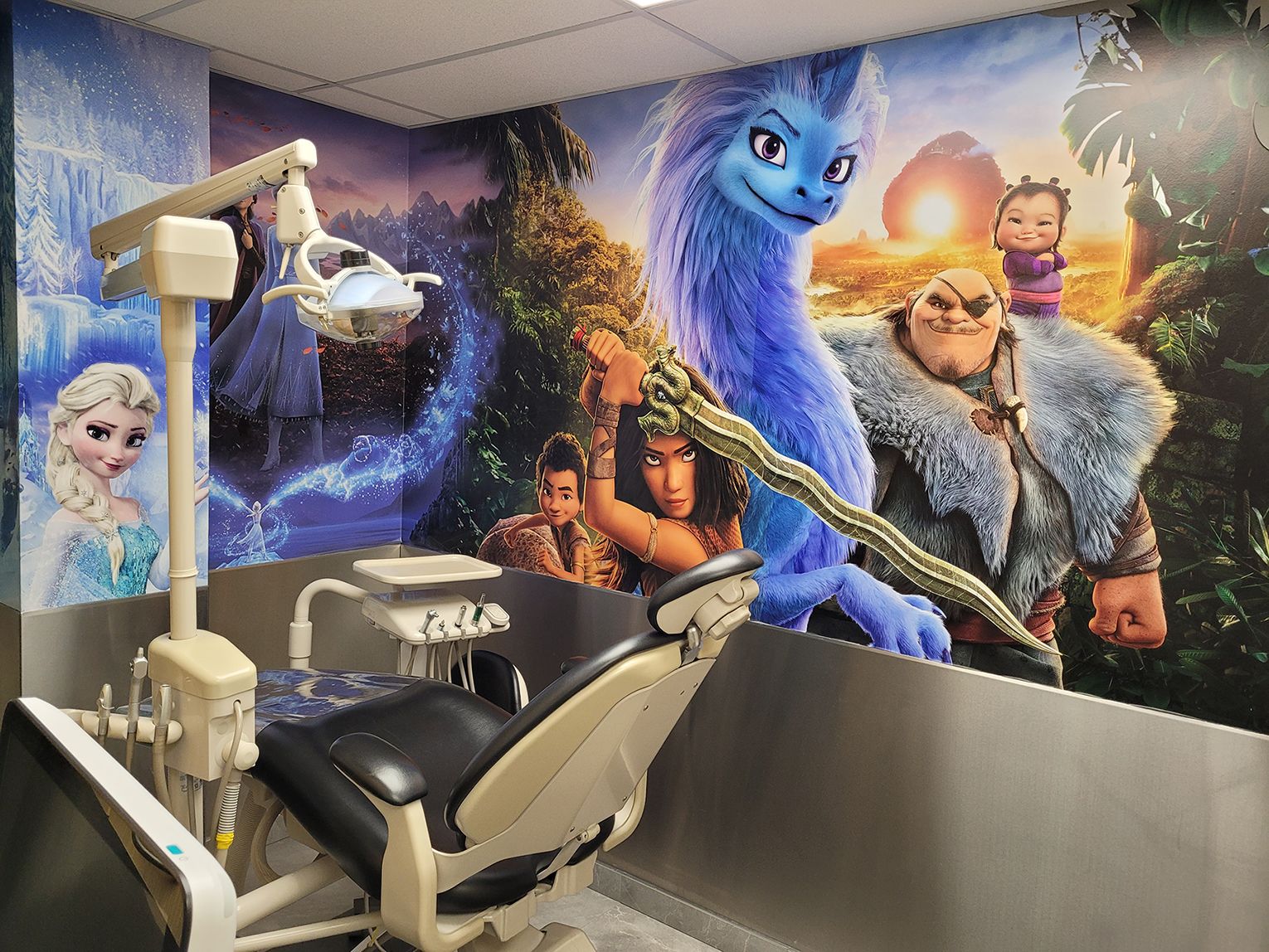A dental treatment room at Northwest Dental Centre featuring a mural fo Disney characters.