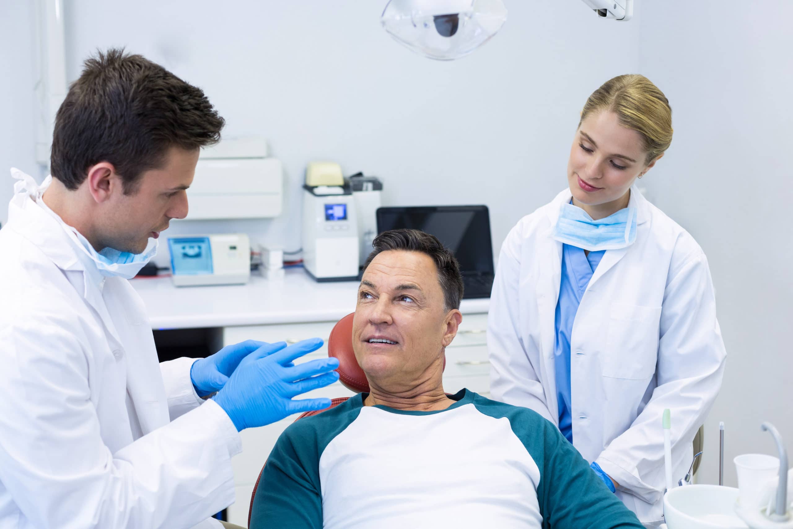 A patient discussing dental sealants with his dentist.