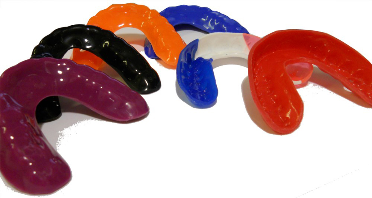 A collection of multi-coloured mouthguards.