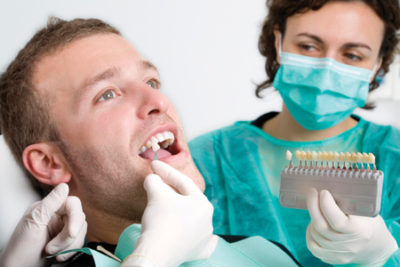 man getting teeth whitening procedure