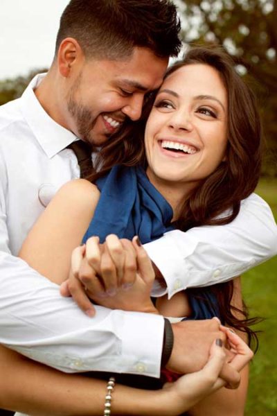 couple smiling after composite bonding procedure