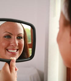 Woman smiling on mirror