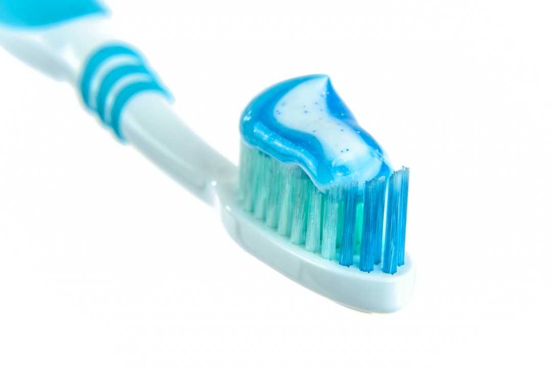 toothpaste on a tooth brush