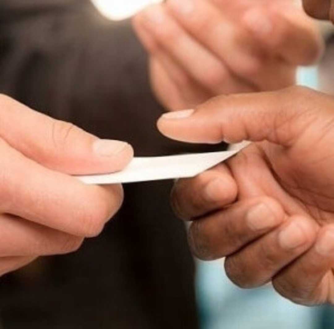 people exchanging business cards