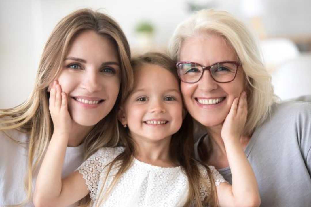 three generations of women with great smiles