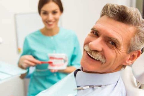 A patient smiling at a dental appointment.