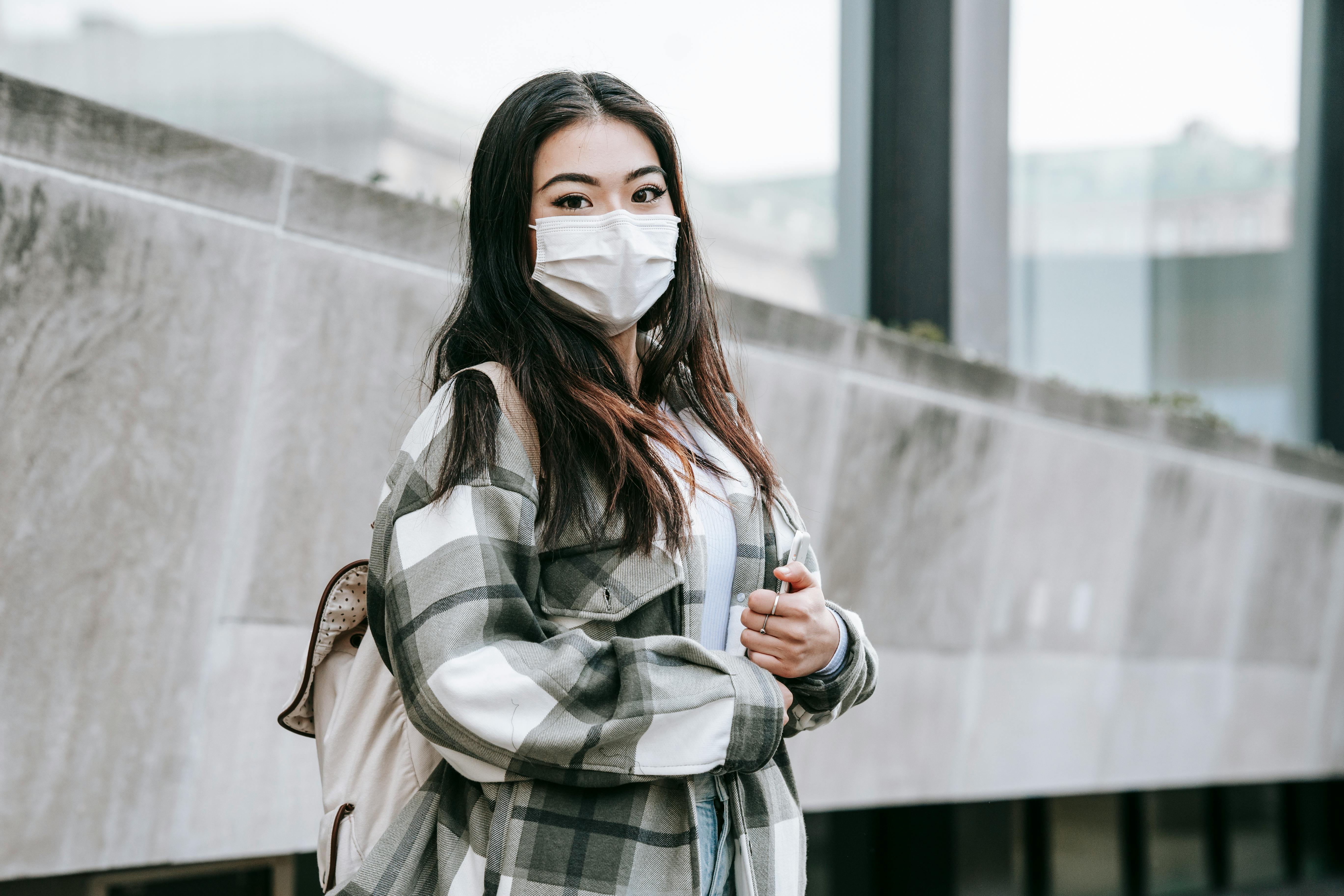 Woman wearing a protective face mask outdoors