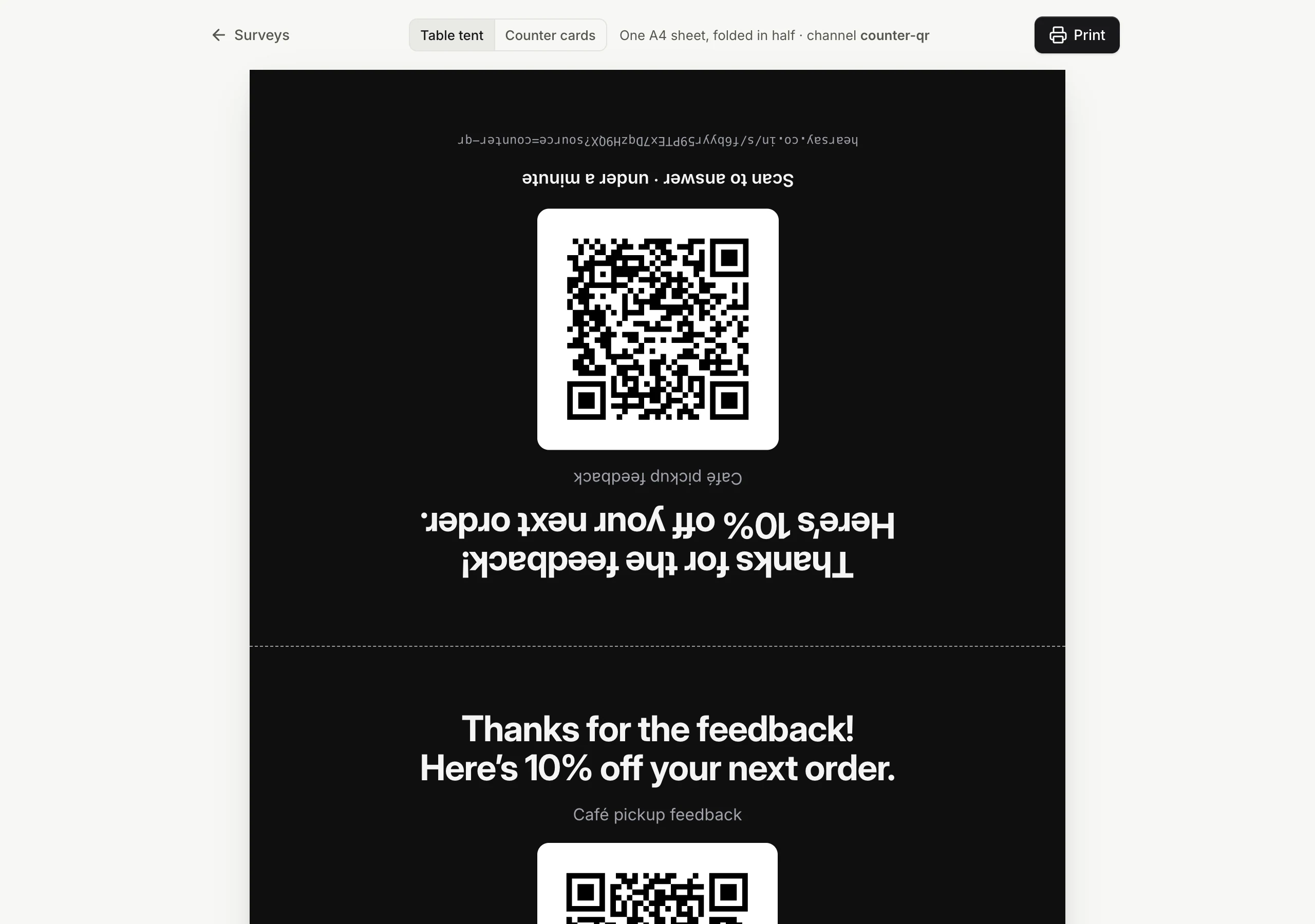 A printable table tent with the coupon headline and the QR code