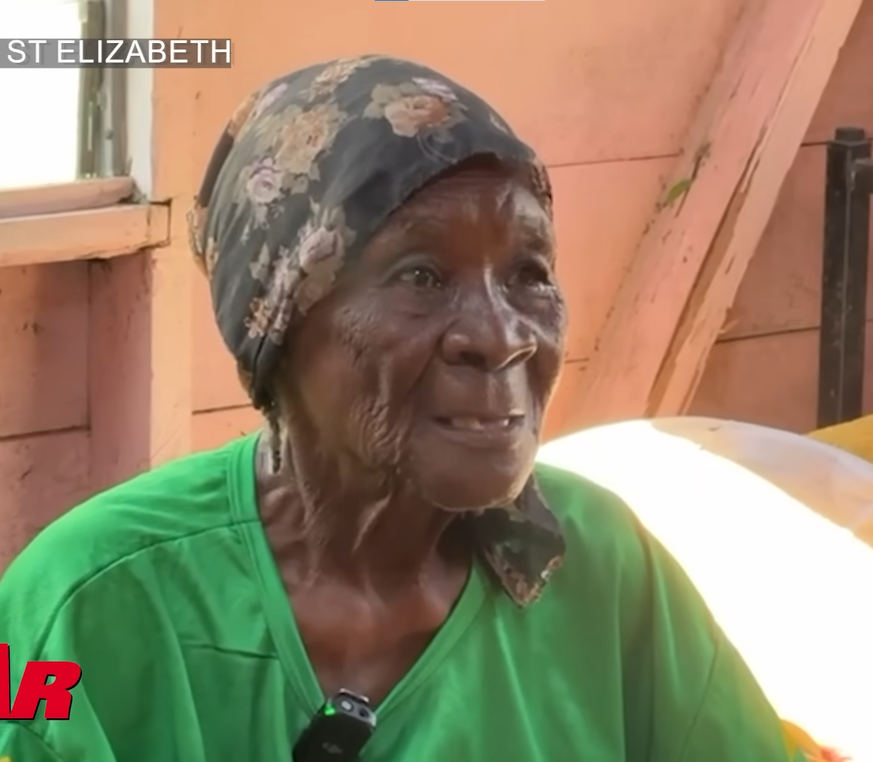 Mrs. Evelyn in temporary tent shelter
