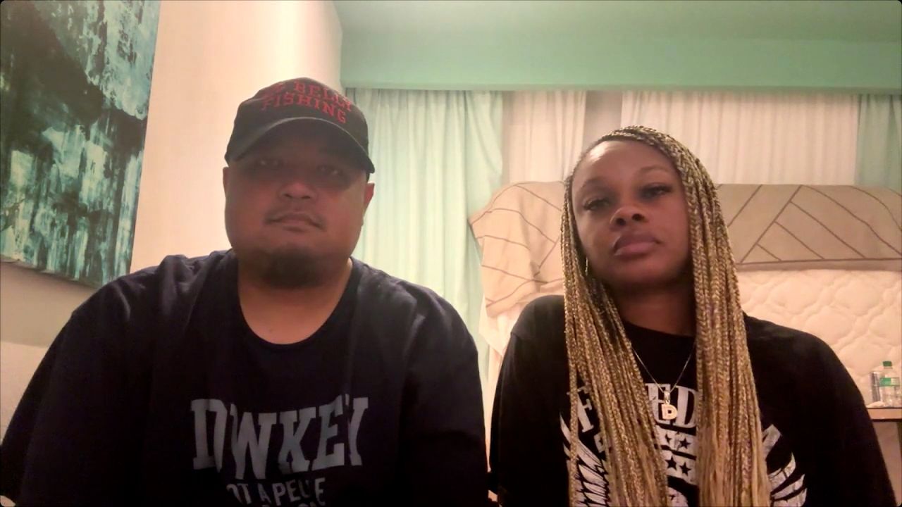 Peter and Dahlia Kong with their children in a temporary shelter