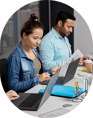 HikeMyTraffic strategists collaborating on a client's digital marketing campaign