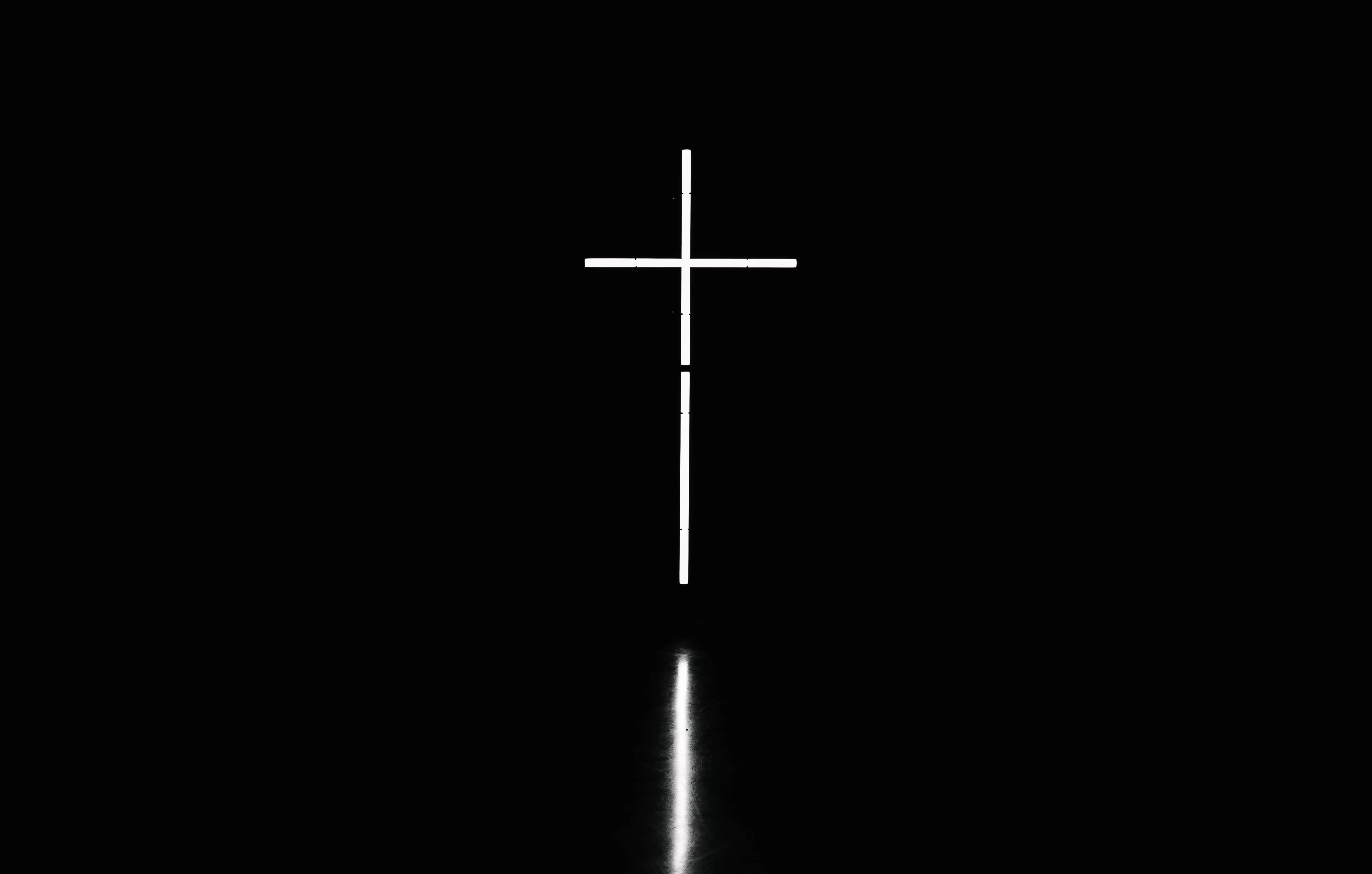 Image of a cross in the darkness