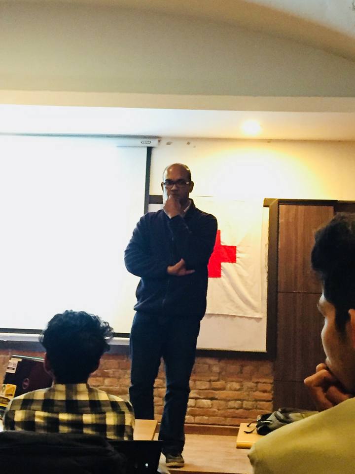 Alok Das listening to an audience member at Kathmandu University