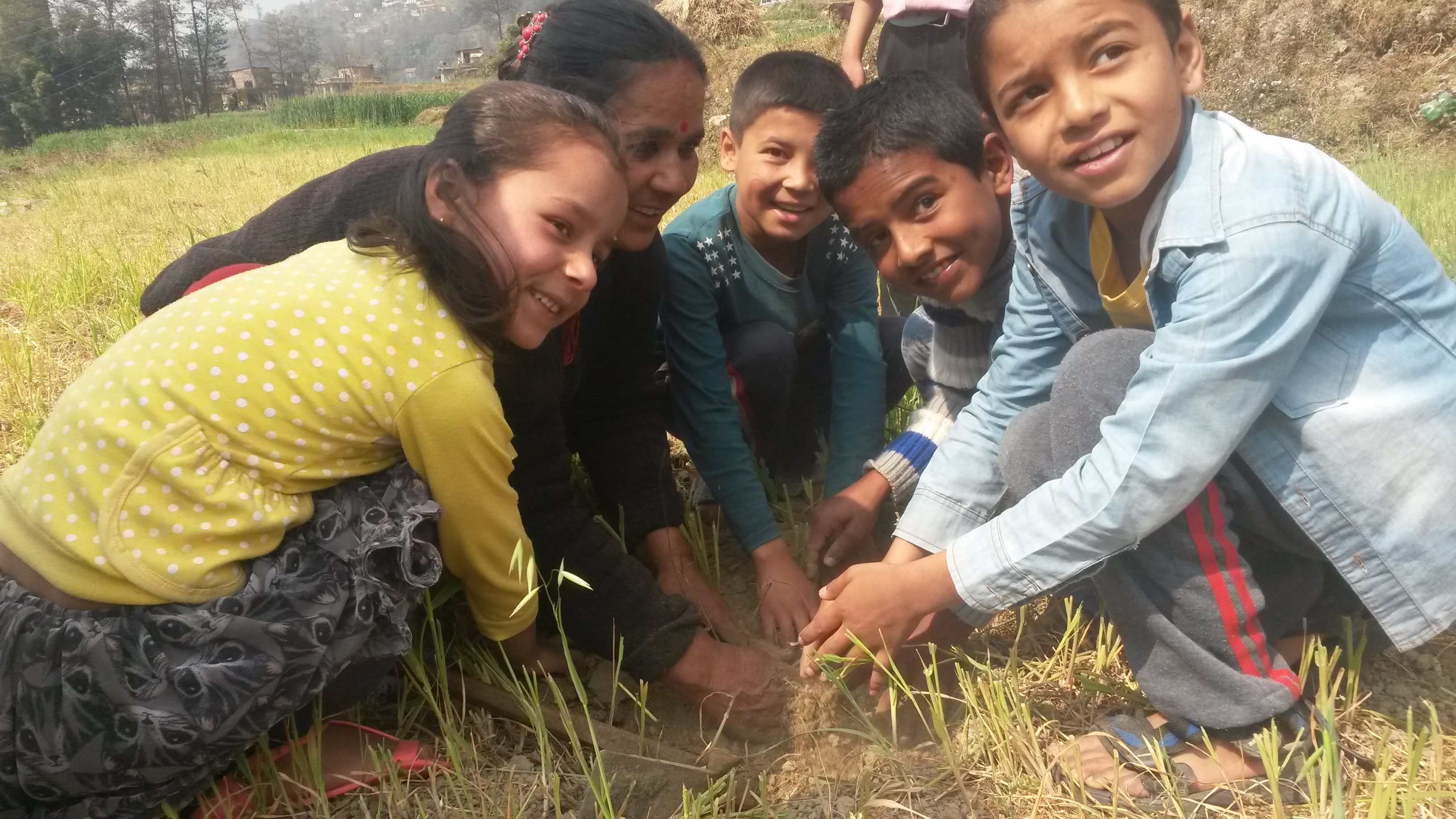 Kids planting a tree