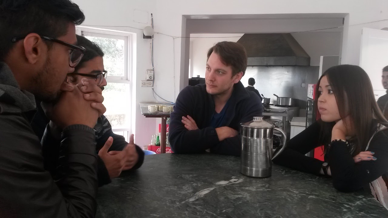 International volunteers discussing a program at Kathmandu University