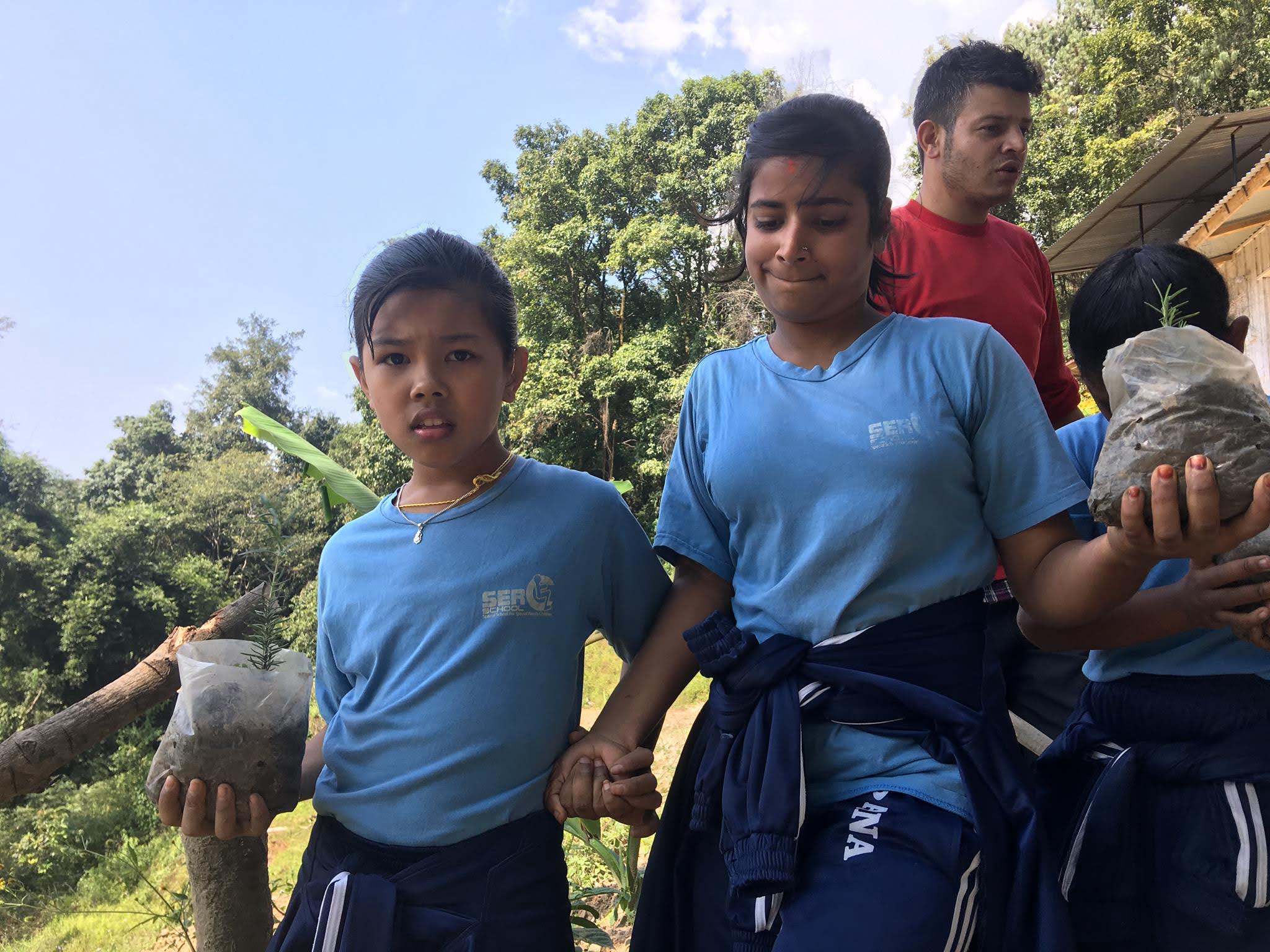 Special needs kids with plants at Nagarkot Community Homestay