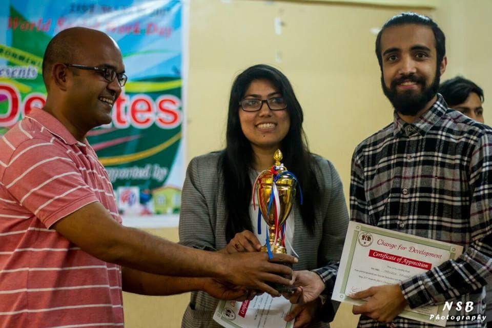 Alok Das distributing a prize at a debate program