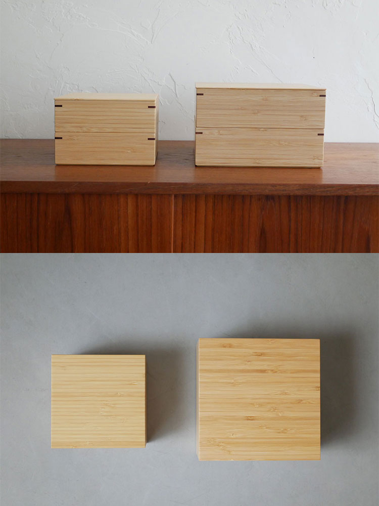 公長斎小菅の竹製二段重箱が木製の棚に展示されている